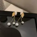 Golden Leaf Pearl Drop Earrings Thumbnail Image 2